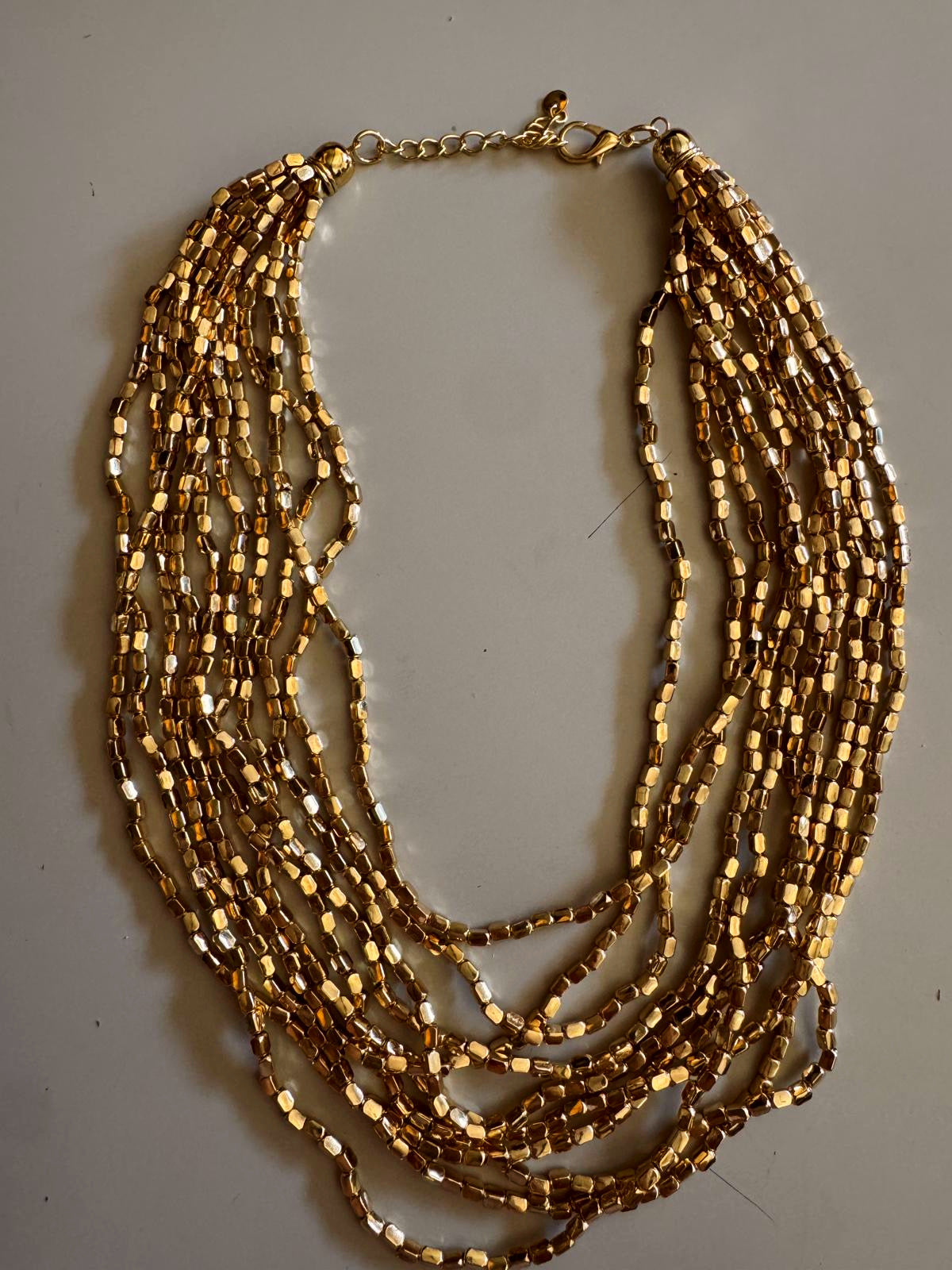 COLLAR MULTICUENTAS DORADAS
