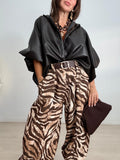 BLUSA OVERSIZE EFECTO PIEL ABOTONADA